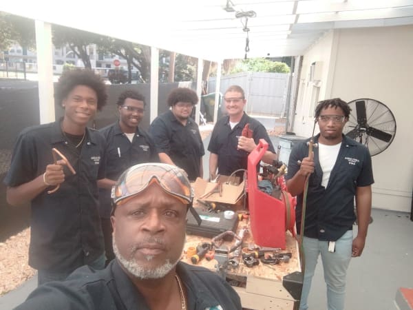 Merryfield Academy HVAC students with an instructor